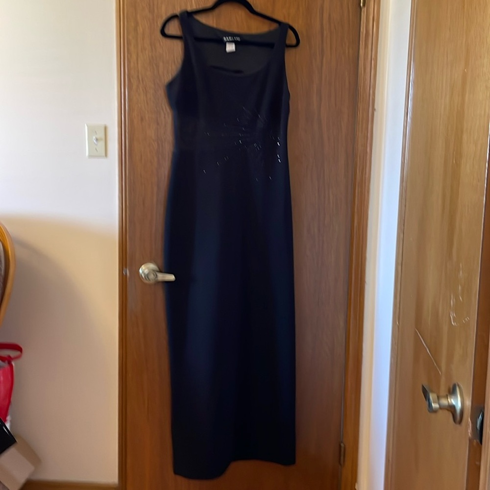 Stunning black floor length gown with mesh and rhinestone detailing.